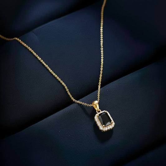 Abidii Regalia Set – halo pendant necklace with matching stud earrings displayed on a soft fabric surface, showing their refined, delicate sparkle.