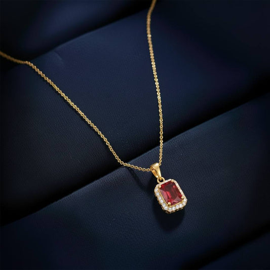 Abidii Regalia Set – halo pendant necklace with matching stud earrings displayed on a soft fabric surface, showing their refined, delicate sparkle.