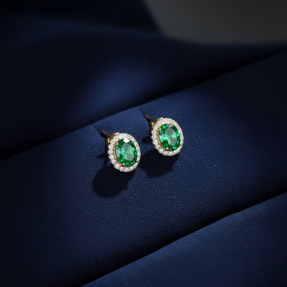 Abidii Eternity Set – oval halo pendant necklace with matching oval stud earrings displayed on a soft fabric surface, showing their timeless, luminous design.