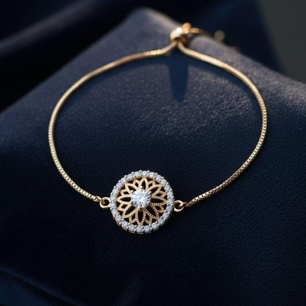 Abidii Everly Bracelet – slim gold-tone bracelet with a round center motif and pavé halo, displayed on dark fabric, showing its radiant, detailed design.