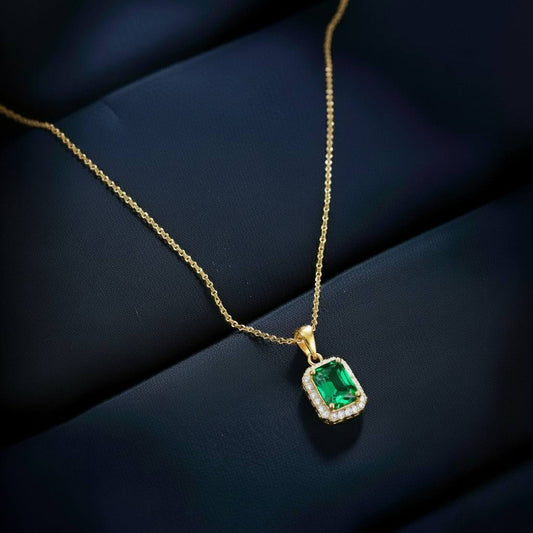 Abidii Regalia Set – halo pendant necklace with matching stud earrings displayed on a soft fabric surface, showing their refined, delicate sparkle.