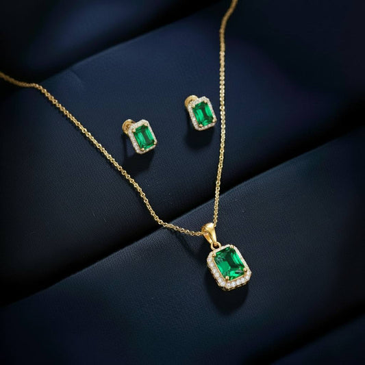 Abidii Regalia Set – halo pendant necklace with matching stud earrings displayed on a soft fabric surface, showing their refined, delicate sparkle.