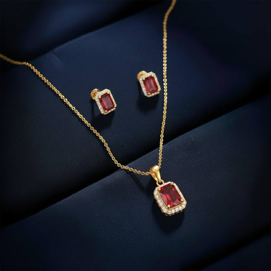 Abidii Regalia Set – halo pendant necklace with matching stud earrings displayed on a soft fabric surface, showing their refined, delicate sparkle.